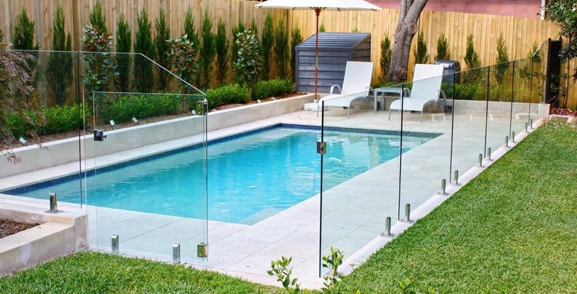 frameless glass fencing installed around a pool