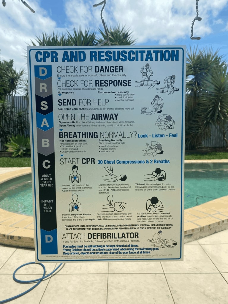 cpr and resuscitation sign on glass pool fence in sydney