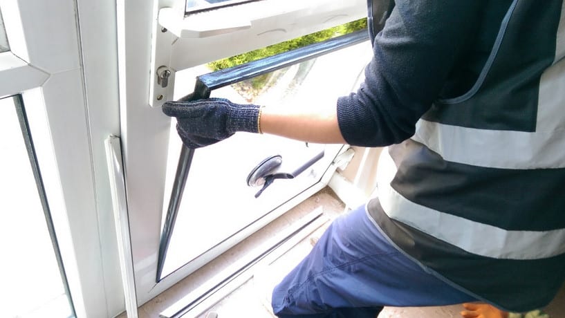 emergency glazier in sydney working on a window