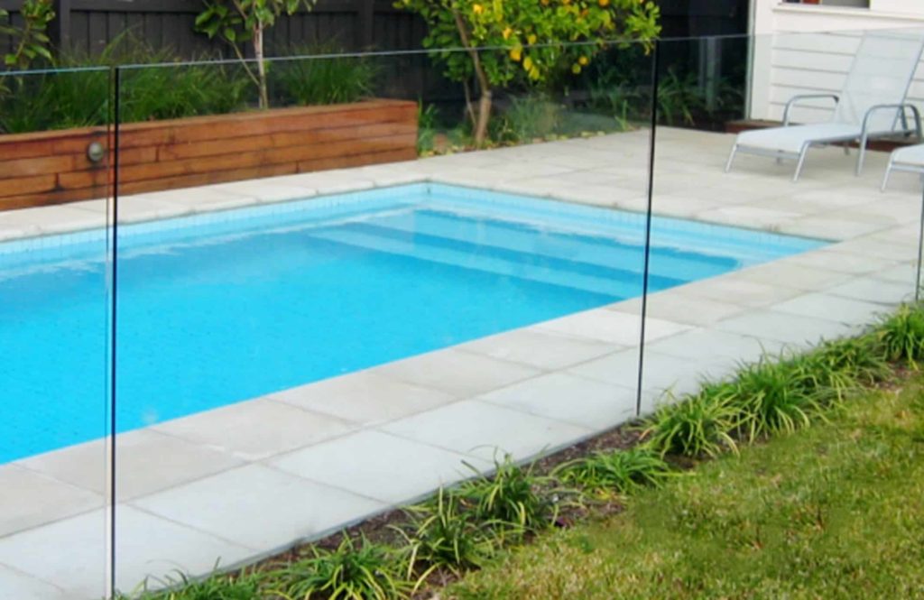 frameless glass pool fence installed in a backyard in bondi sydney