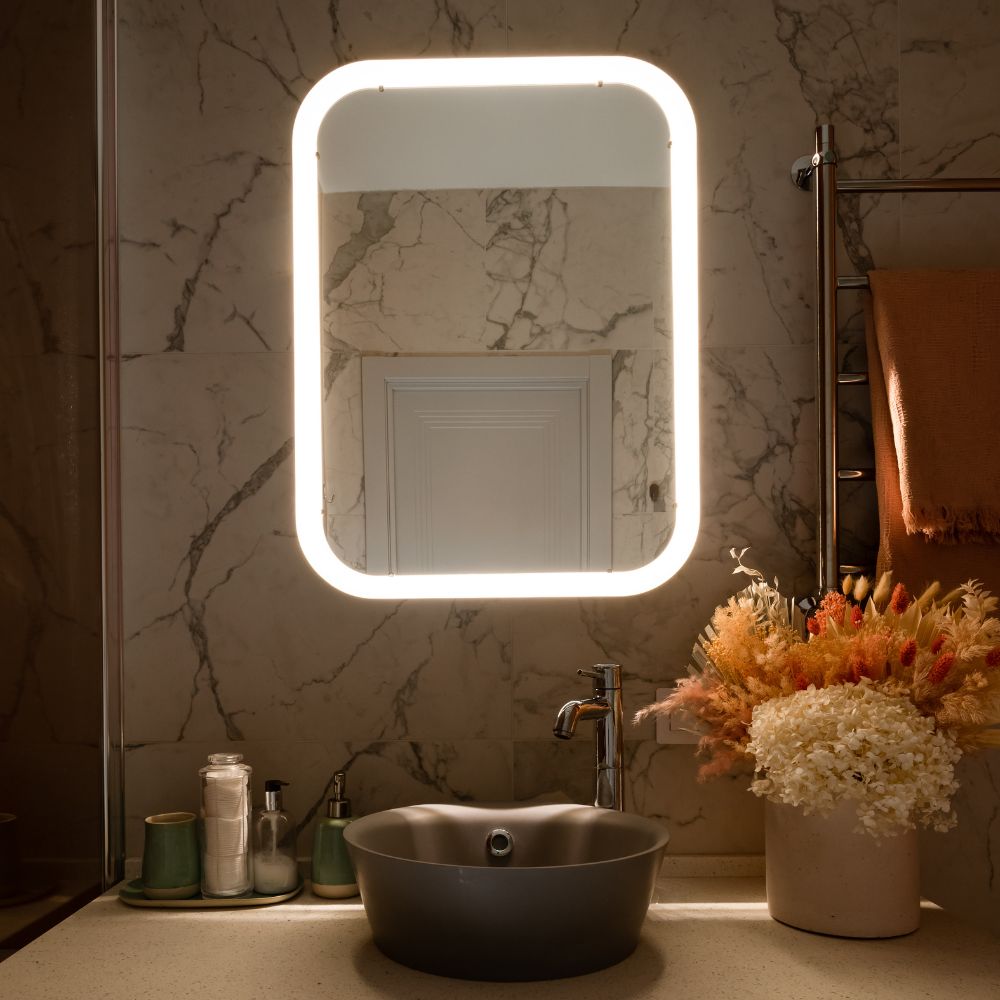 lighted wall mirror in a bathroom in sydney