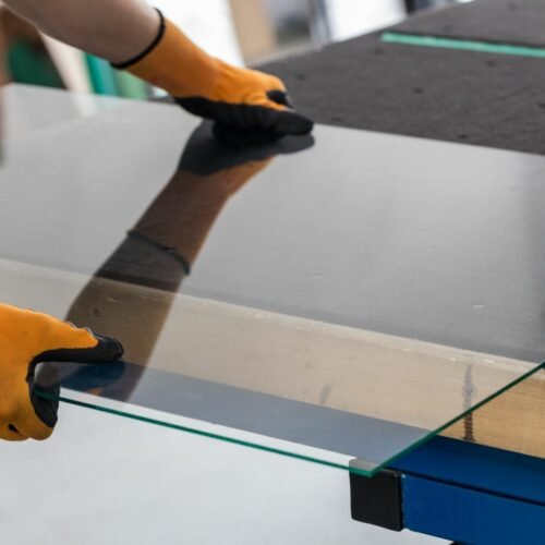 glazier-lifting-a-glass-made-for-table-top-500x500