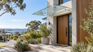 Frameless glass awning above the entrance of a modern Australian home